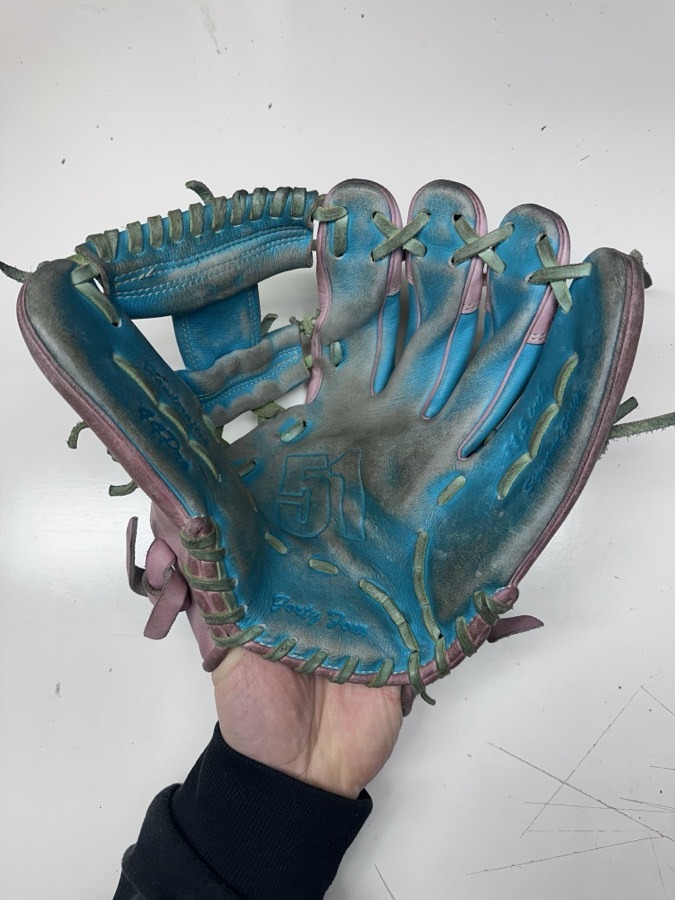 44 Pro baseball glove before restoration — worn leather and frayed laces