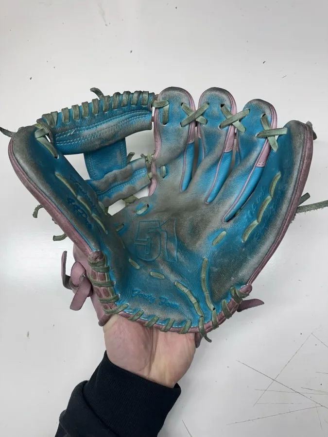 44 Pro baseball glove before restoration — worn leather and frayed laces