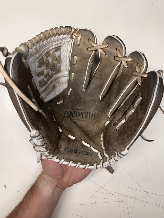Easton baseball glove before restoration — worn leather and frayed laces