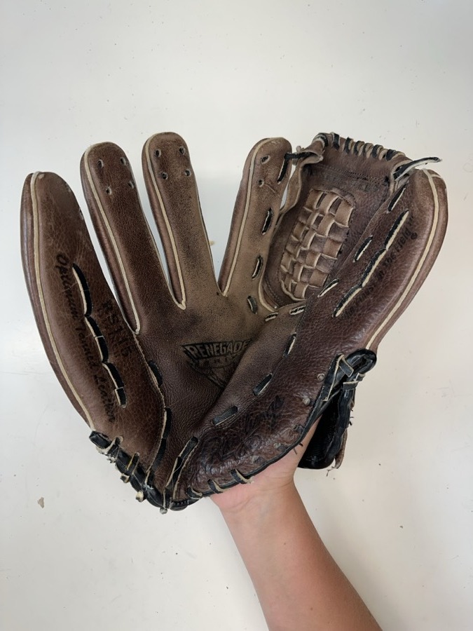 Rawlings baseball glove before restoration — worn leather and frayed laces