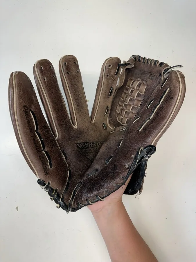 Rawlings baseball glove before restoration — worn leather and frayed laces