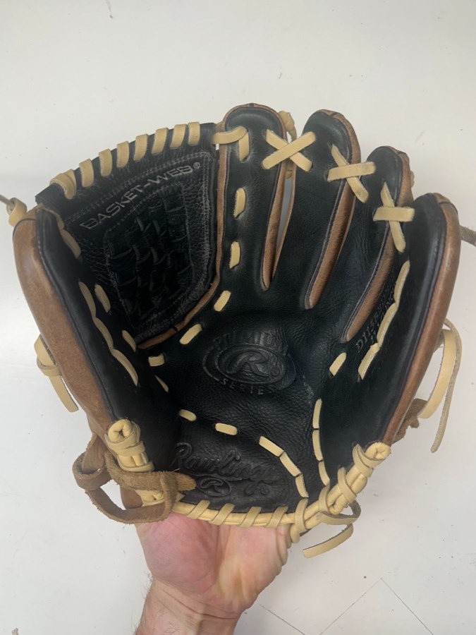 Rawlings baseball glove before restoration — worn leather and frayed laces