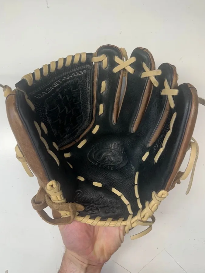 Rawlings baseball glove before restoration — worn leather and frayed laces