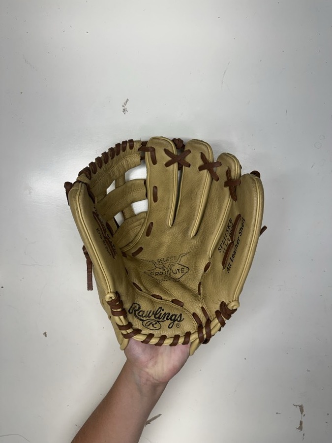 Rawlings baseball glove before restoration — worn leather and frayed laces