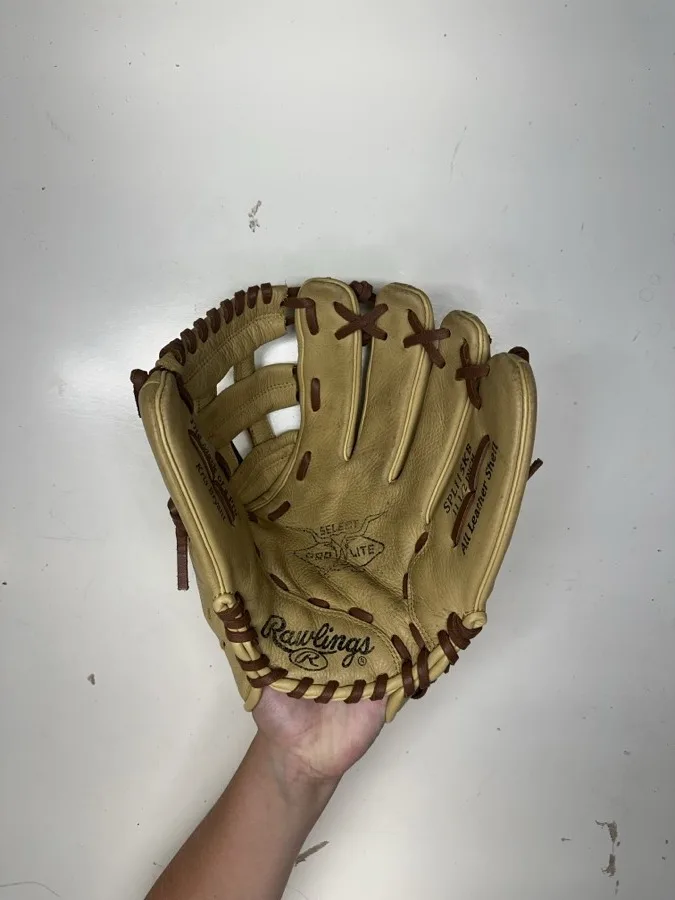 Rawlings baseball glove before restoration — worn leather and frayed laces