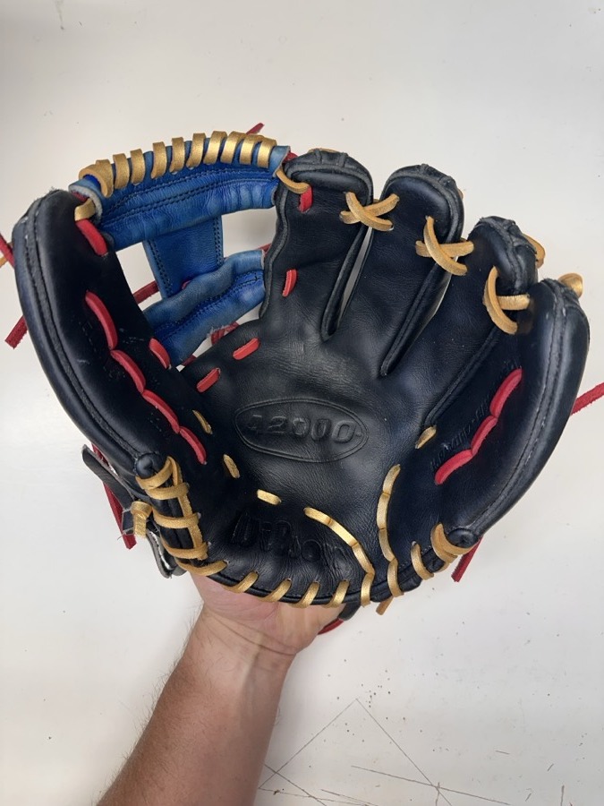 Wilson baseball glove after restoration by Blank Bros Glove Co. — cleaned, conditioned, and relaced