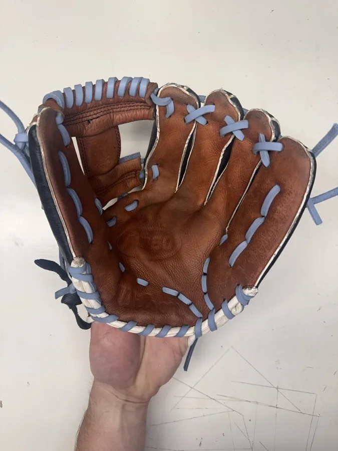 Wilson baseball glove after restoration by Blank Bros Glove Co. — cleaned, conditioned, and relaced