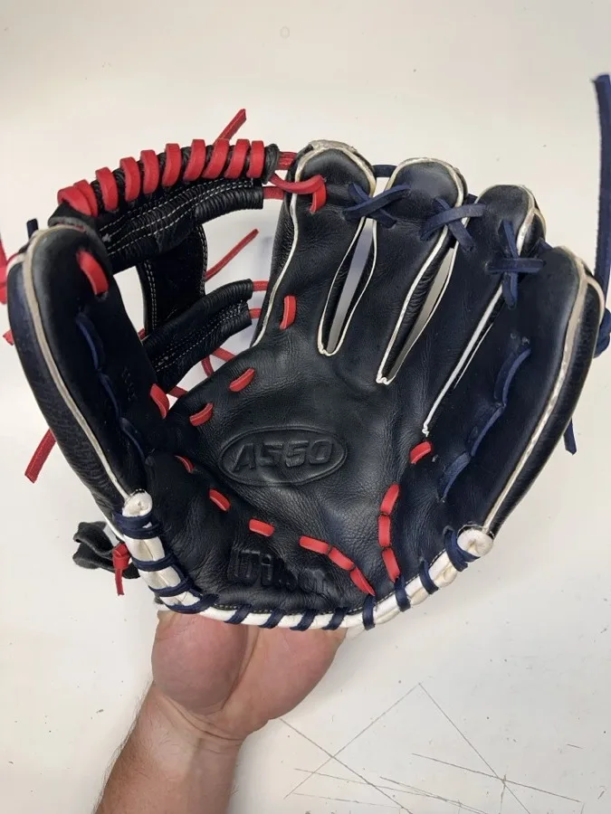 Wilson baseball glove after restoration by Blank Bros Glove Co. — cleaned, conditioned, and relaced