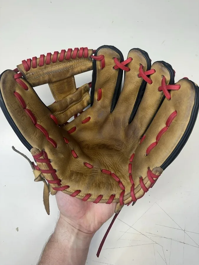 Wilson baseball glove after restoration by Blank Bros Glove Co. — cleaned, conditioned, and relaced