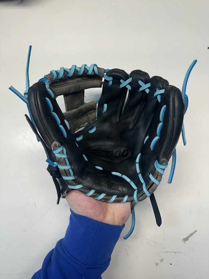 Wilson baseball glove after restoration by Blank Bros Glove Co. — cleaned, conditioned, and relaced