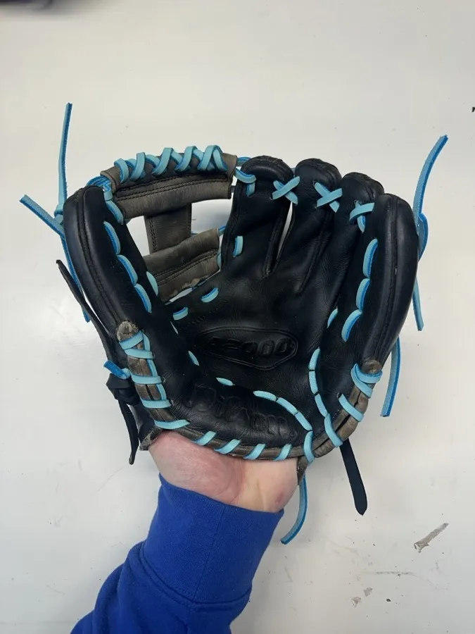 Wilson baseball glove after restoration by Blank Bros Glove Co. — cleaned, conditioned, and relaced