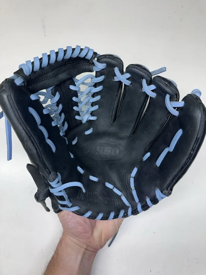 Wilson baseball glove after restoration by Blank Bros Glove Co. — cleaned, conditioned, and relaced