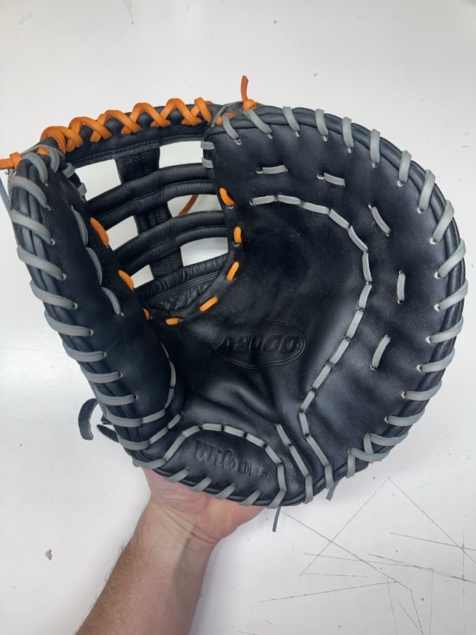 Wilson professional-grade baseball glove after cleaning, conditioning, and relacing with fresh laces