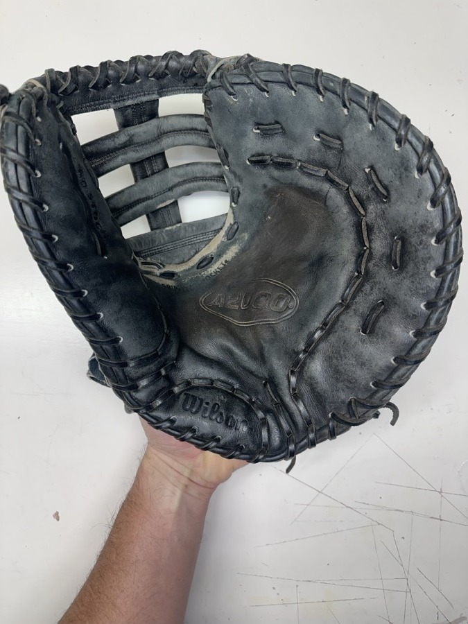 Wilson professional-grade baseball glove before cleaning, conditioning, and relacing