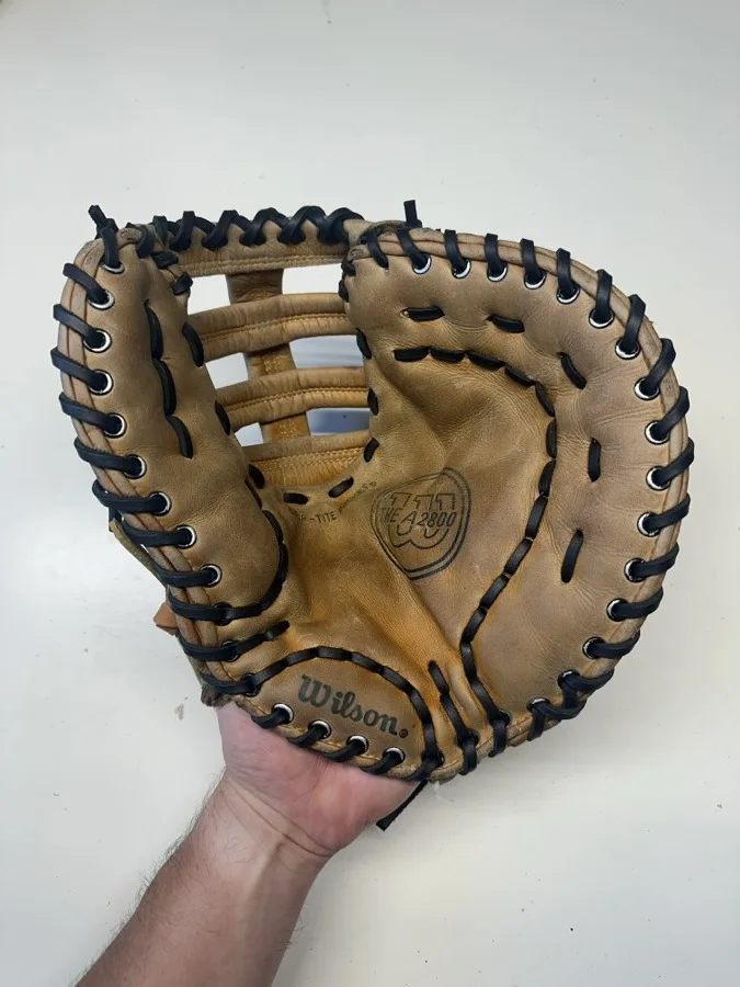 Wilson baseball glove after restoration by Blank Bros Glove Co. — cleaned, conditioned, and relaced