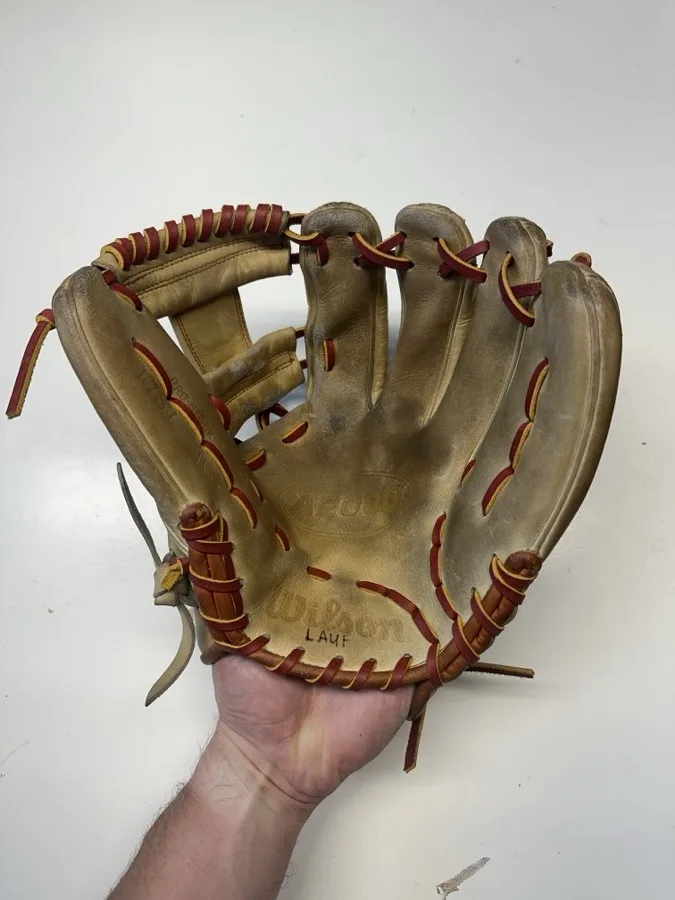 Wilson baseball glove after restoration by Blank Bros Glove Co. — cleaned, conditioned, and relaced