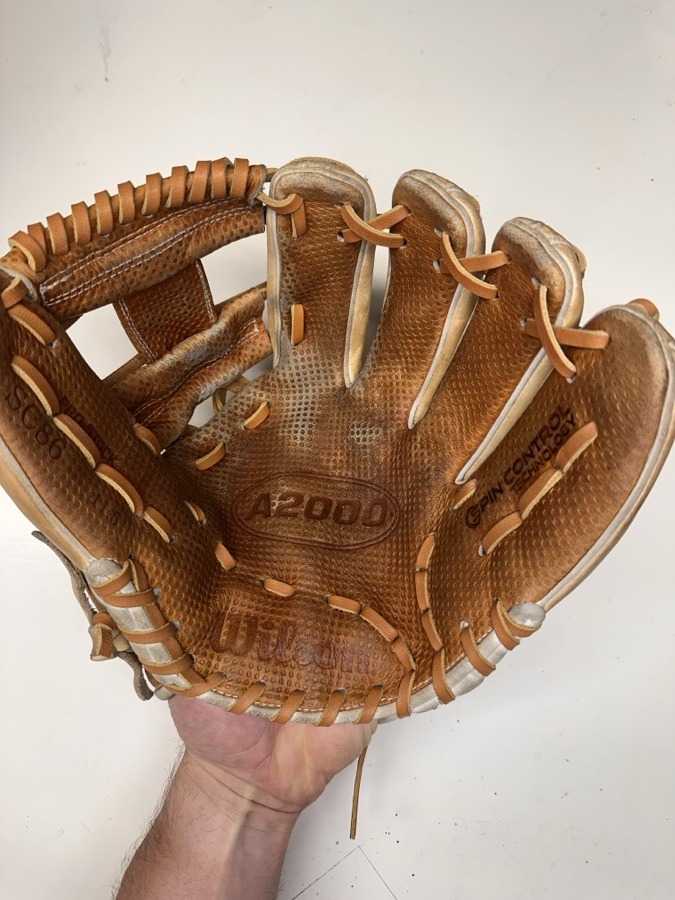 Wilson baseball glove after restoration by Blank Bros Glove Co. — cleaned, conditioned, and relaced