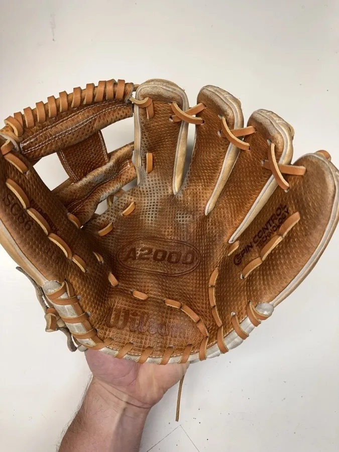 Wilson baseball glove after restoration by Blank Bros Glove Co. — cleaned, conditioned, and relaced